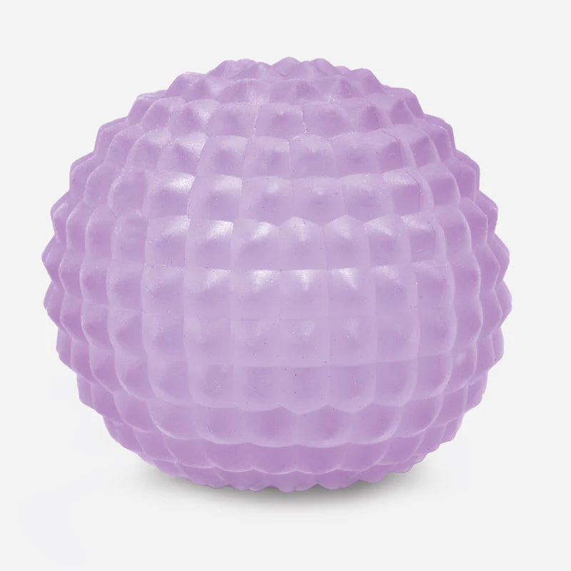 Purple textured squish ball on a light gray background