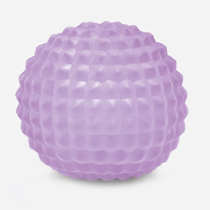 Purple textured squish ball on a light gray background