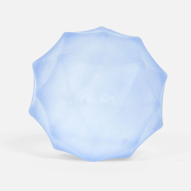 Light blue geometric squish toy on a white background