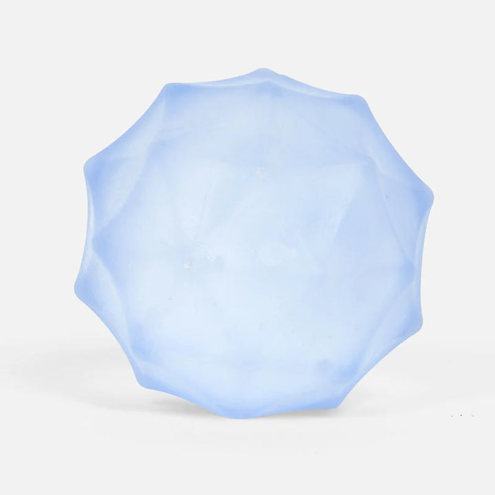 Light blue geometric squish toy on a white background