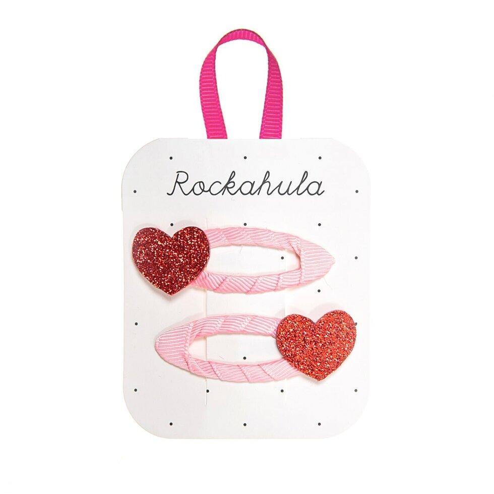 set of 2 snap clips covered in pink ribbon with red heart attached. 