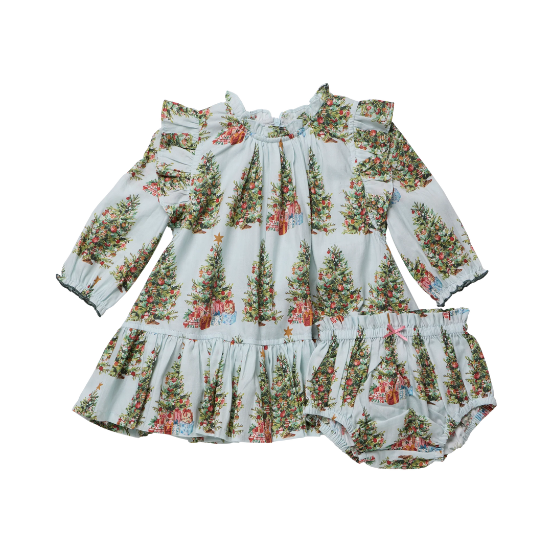 A baby girl's two-piece outfit featuring a long-sleeve smocked dress and matching bloomers, both printed with a festive Christmas tree pattern on a pale blue background.