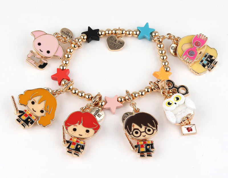 charm bracelet with all of the charms for Harry Potter attached. Harry Potter, Ron Weasley, Hermione Grainger, Dobby, Luna Lovegood, and the owl