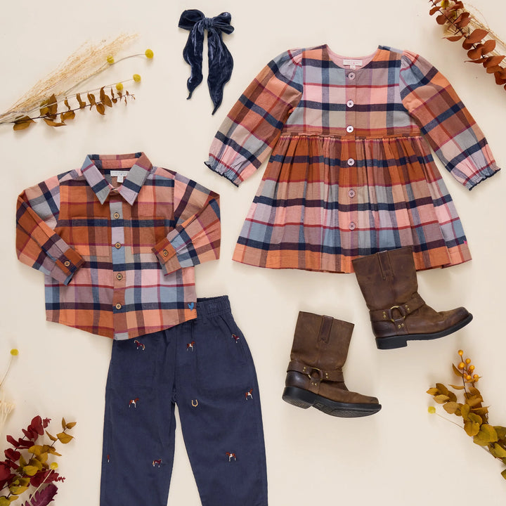 picture of long sleeve plaid dress and matching young boy collared shirt and navy pants. 
