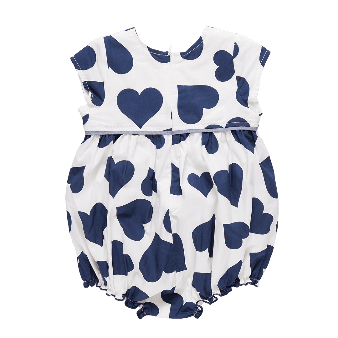 Back view of the baby bubble, white background color and large navy hearts all over the bubble. hidden zipper in the back. 
