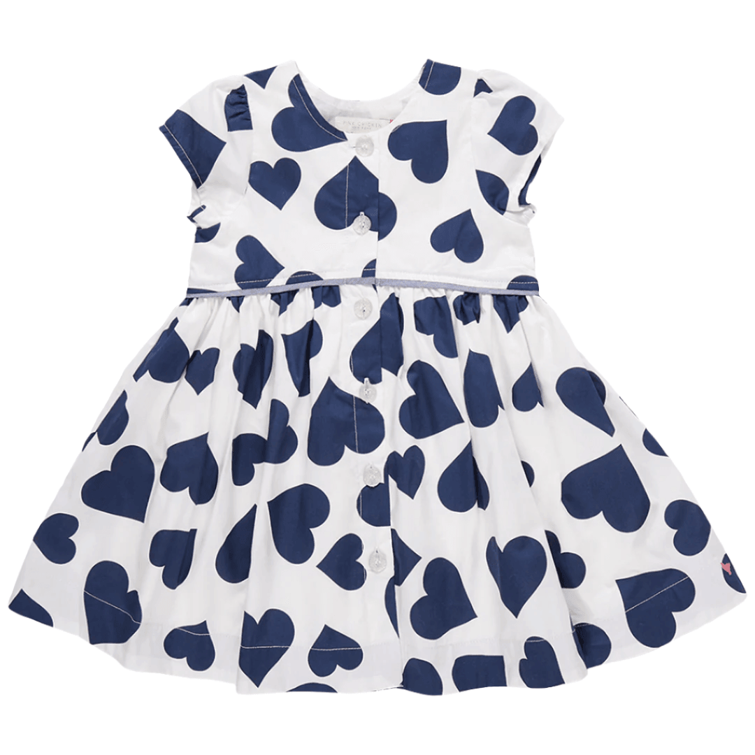 button down shirt dress with no collar, white background with large navy hearts. cap sleeve