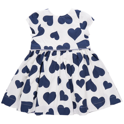 back of dress. empire waisted. white background with large navy hearts all over. 