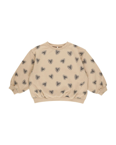 oversized girls sweatshirt, beige color with navy/gray hearts all over. 