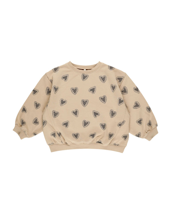 oversized girls sweatshirt, beige color with navy/gray hearts all over. 