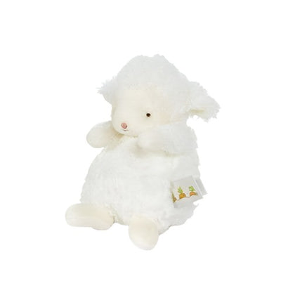 small white plush lamb with rosy cheeks. This is a side view of the plush. 