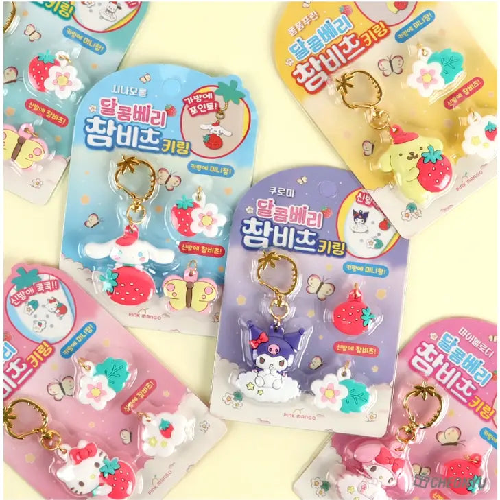 Collection of colorful keychains in packaging on a yellow background