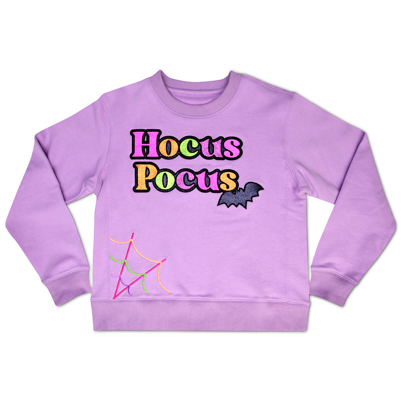 purple sweatshirt with the words "Hocus Pocus" written on it 