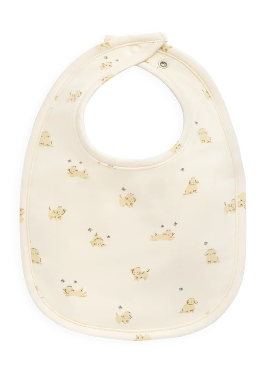 Baby bib with gold puppy prints on a white background