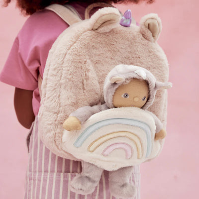 unicorn hopalong backpack with doll on the back in the pocket