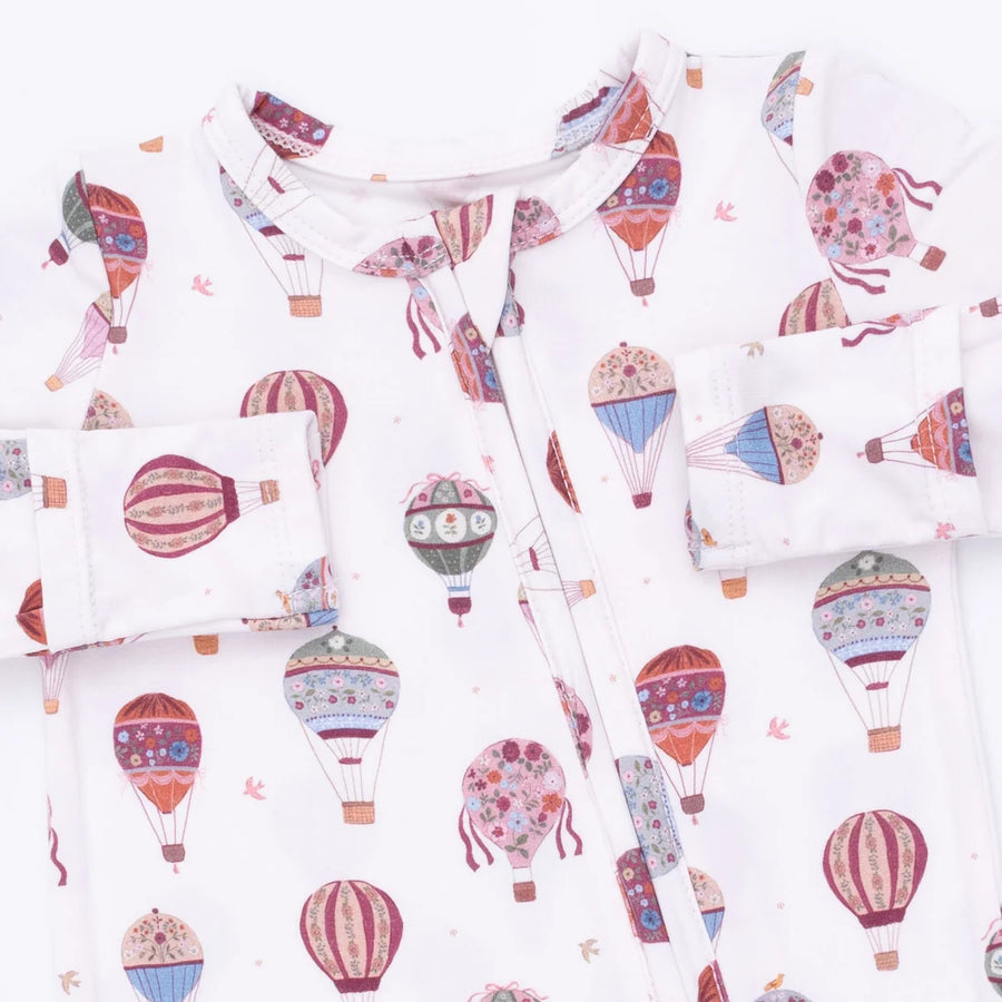 baby footie with colorful hot air balloon pattern on a white background