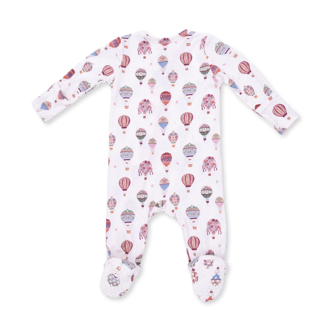 A baby long-sleeve footed sleeper in white with an all-over pink and purple hot air balloon pattern, shown flat on a white background.