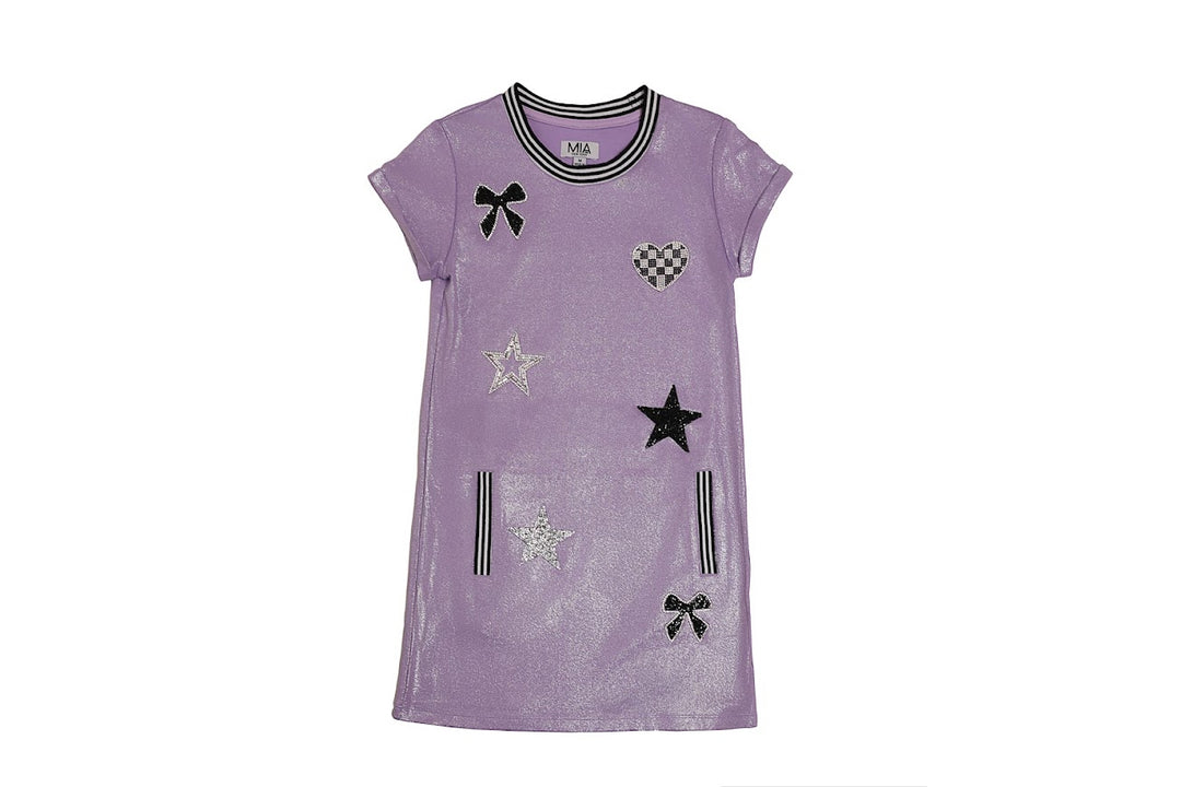 Purple dress with black star and bow patterns on a white background