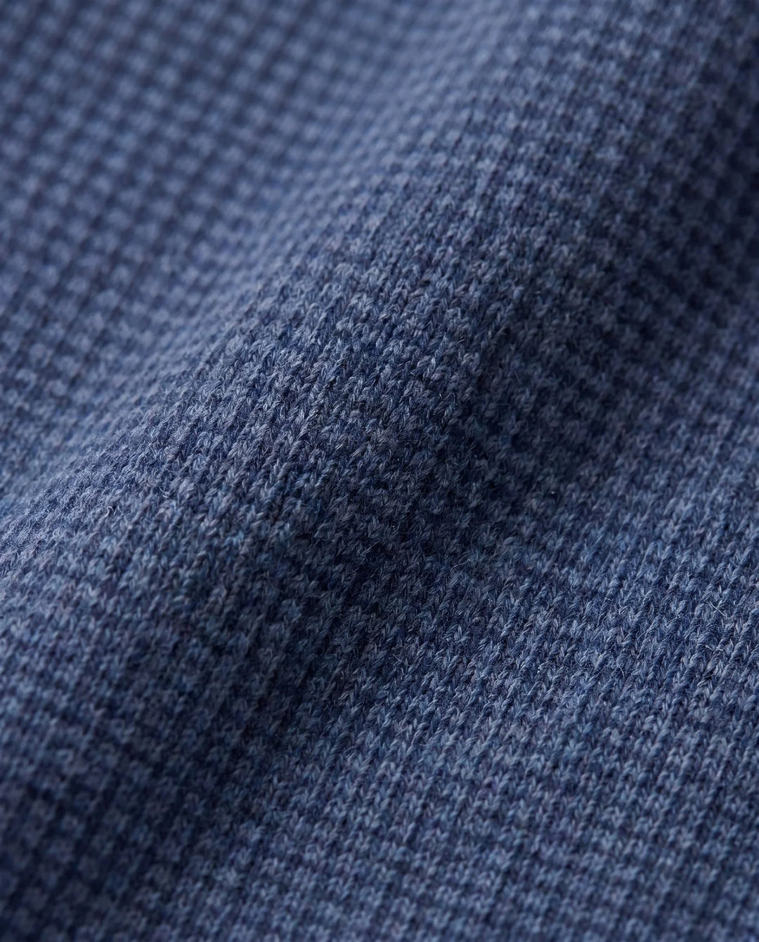 close up to the color and texture Navy with a micro check on it. 