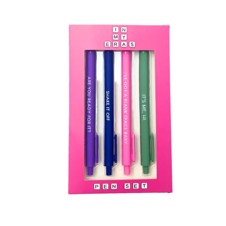 set of 4 gel pens in a pink case that says "in My Eras Pen Set " : pink, green, blue and purple pens. One says: Its, me hi; Ive got a blank space baby; shake it off; are you ready for it. 