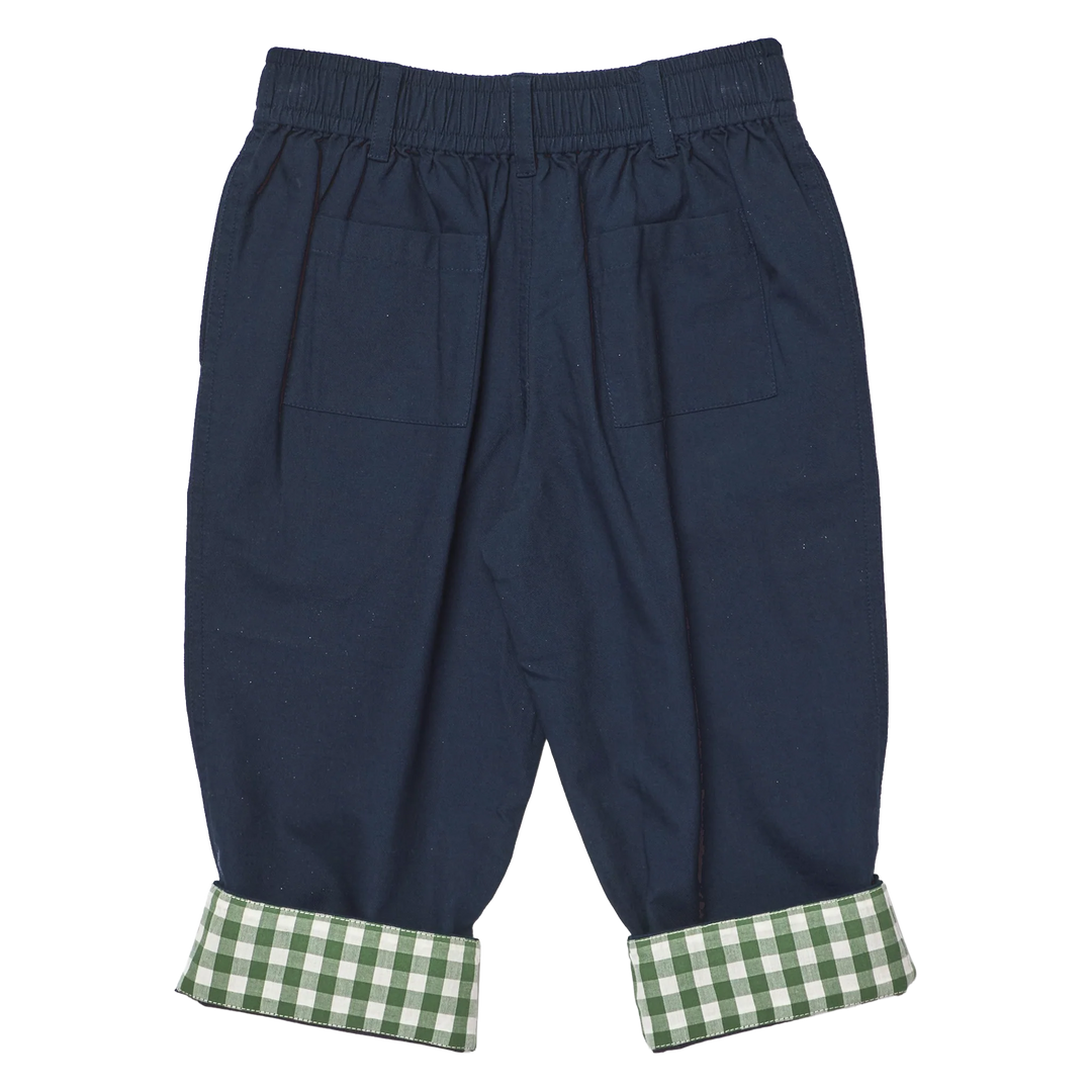 Back of Navy blue  pants with an elastic waistband, side pockets, and green and white gingham cuffs, shown flat on a white background.