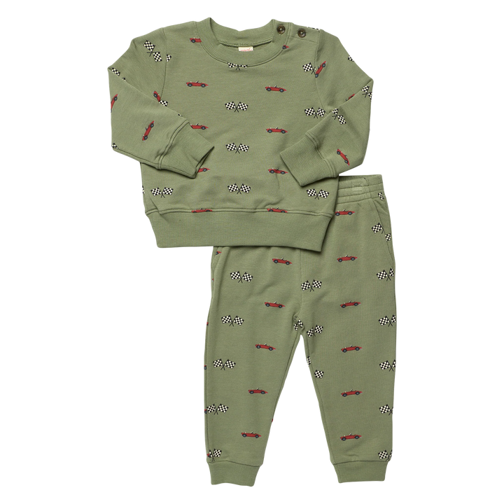 A two-piece kids' loungewear set in sage green, featuring a long-sleeve sweatshirt and matching jogger pants. The set is decorated with a repeating pattern of small red cars on black and white checkered flags.