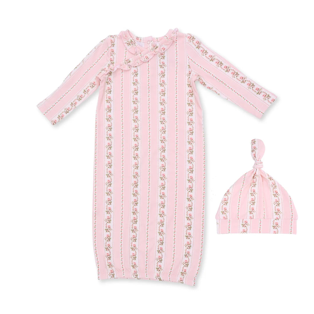 A baby sleep suit and matching knotted beanie hat in light pink fabric with vertical stripes and small floral prints, shown on a plain white background.