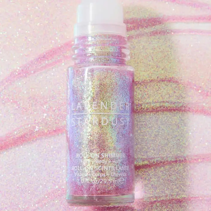 Roll-on glitter product with 'Lavender Stardust' branding on a glittery background
