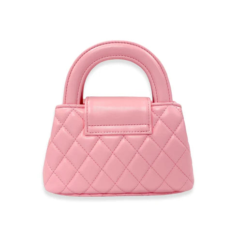 Pink quilted handbag on a white background