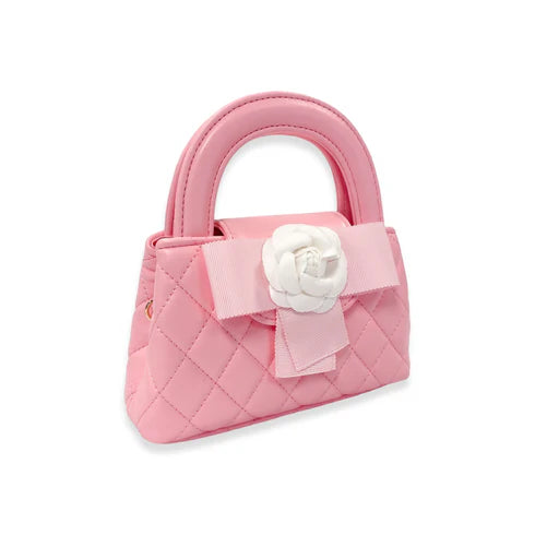 Pink quilted handbag with a white flower and bow