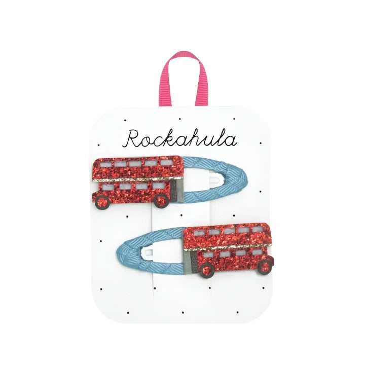 set of 2 blue snap clips, each have red glitter London double decker bus on it