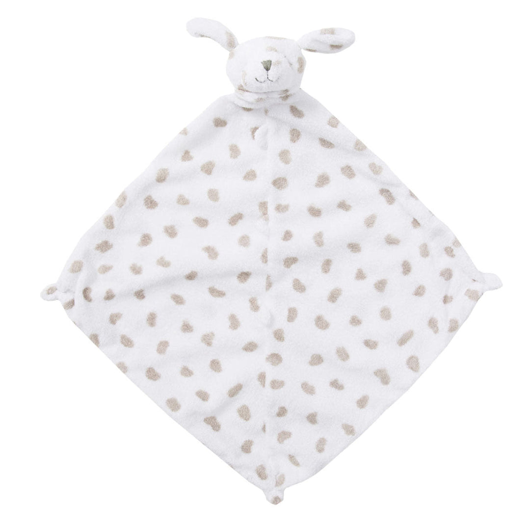 White dog with spots attached to a baby comfort blanket with brown dots and bunny ears on a white background