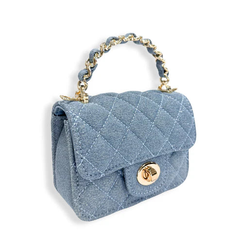 Blue quilted handbag with gold chain handle on a white background