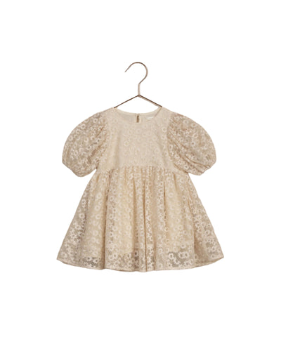 cream dress with balloon sleeves and daisy embroidery all over the dress. 