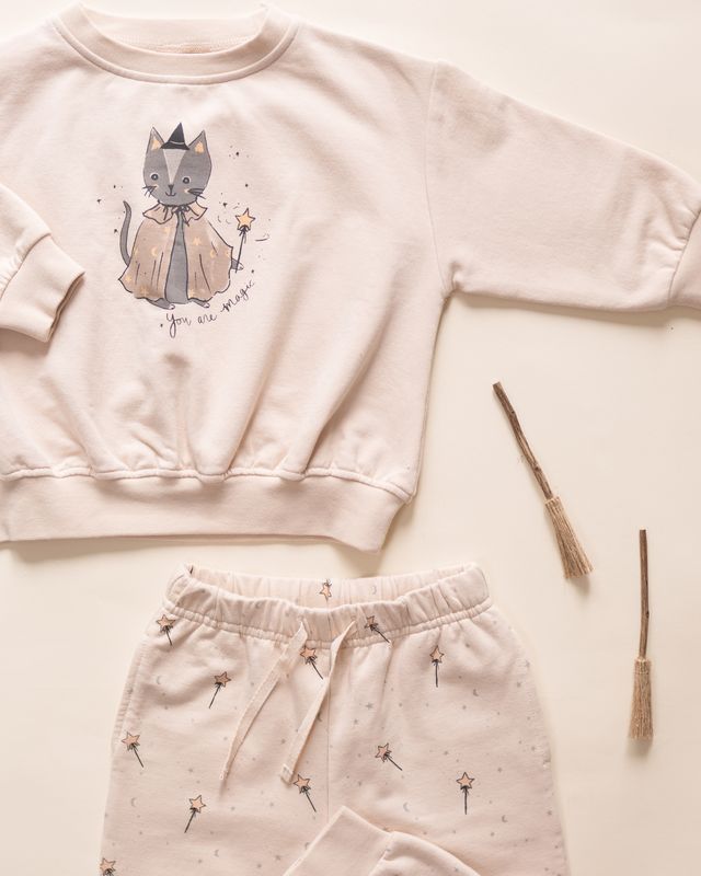 Children's sweat set with a cat and magic wand design on a light background