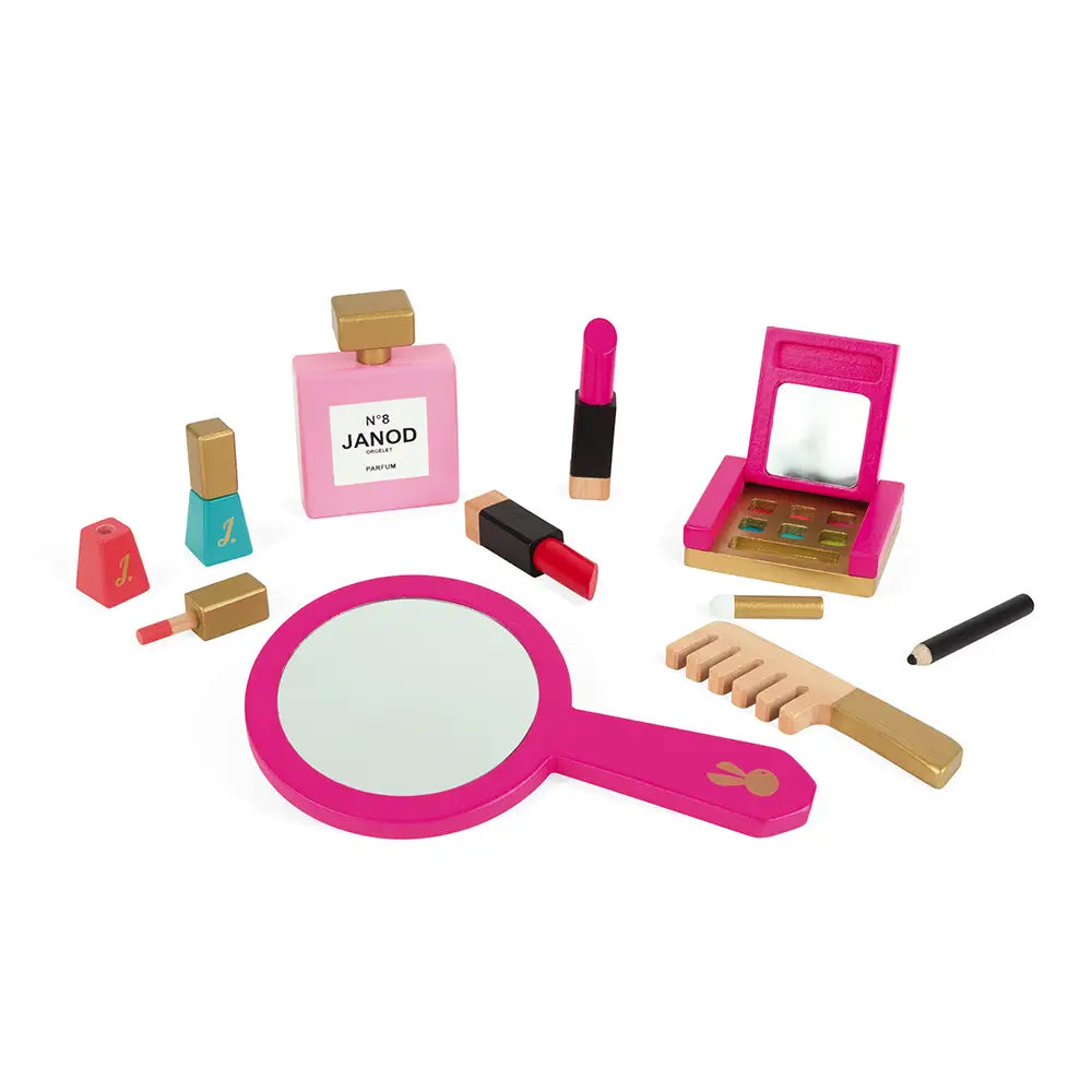 Set of toy makeup items including a mirror, lipstick, nail polish, and perfume on a white background