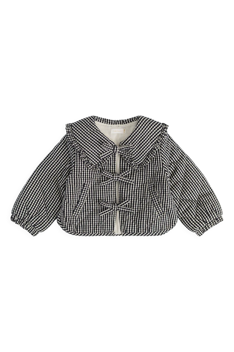 A black and white gingham patterned baby jacket with a ruffled collar, tie-front closure, and long balloon sleeves, shown flat on a white background.