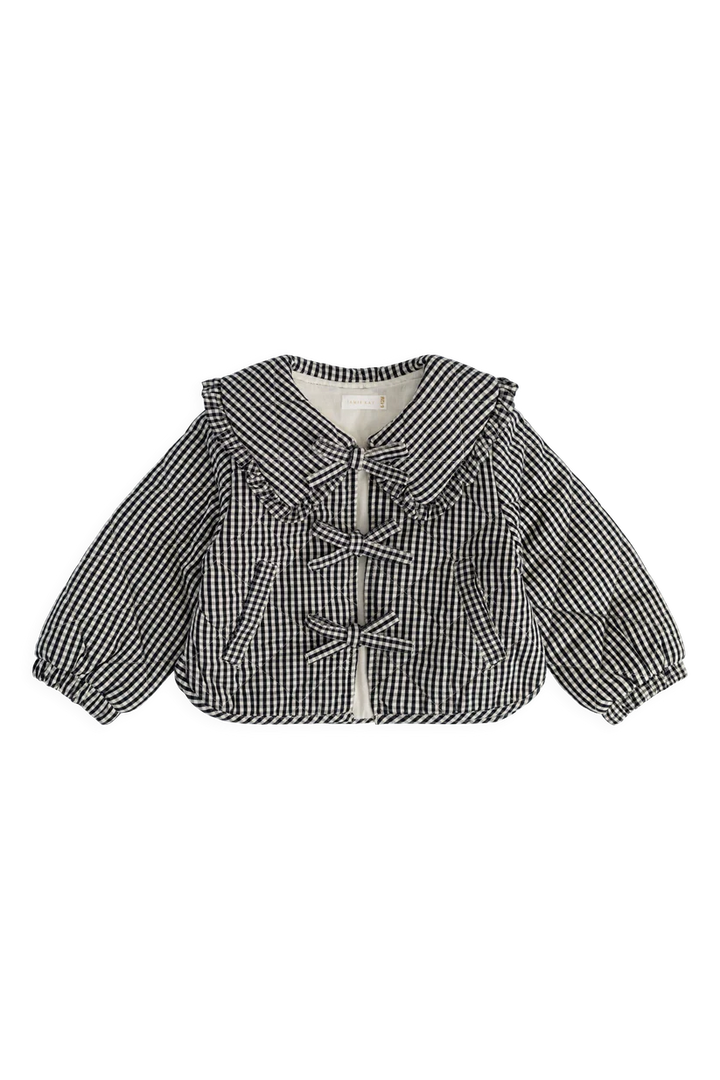 A black and white gingham patterned baby jacket with a ruffled collar, tie-front closure, and long balloon sleeves, shown flat on a white background.