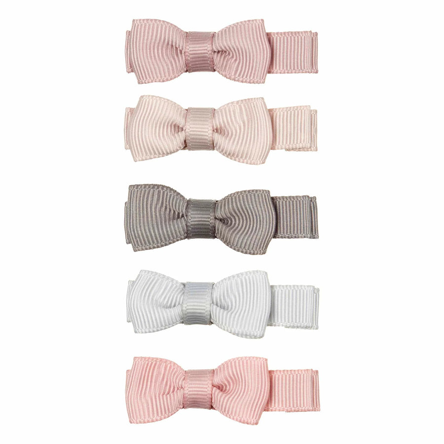 Five ribbon bow clips in soft pastel colors, including pink, blush, taupe, light gray, and pale pink, arranged vertically on a plain white background.