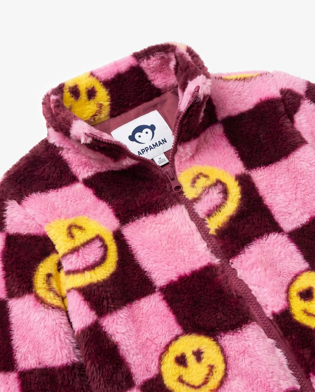 girls checkered sherpa pink and burgundy with yellow smiley faces on it. 