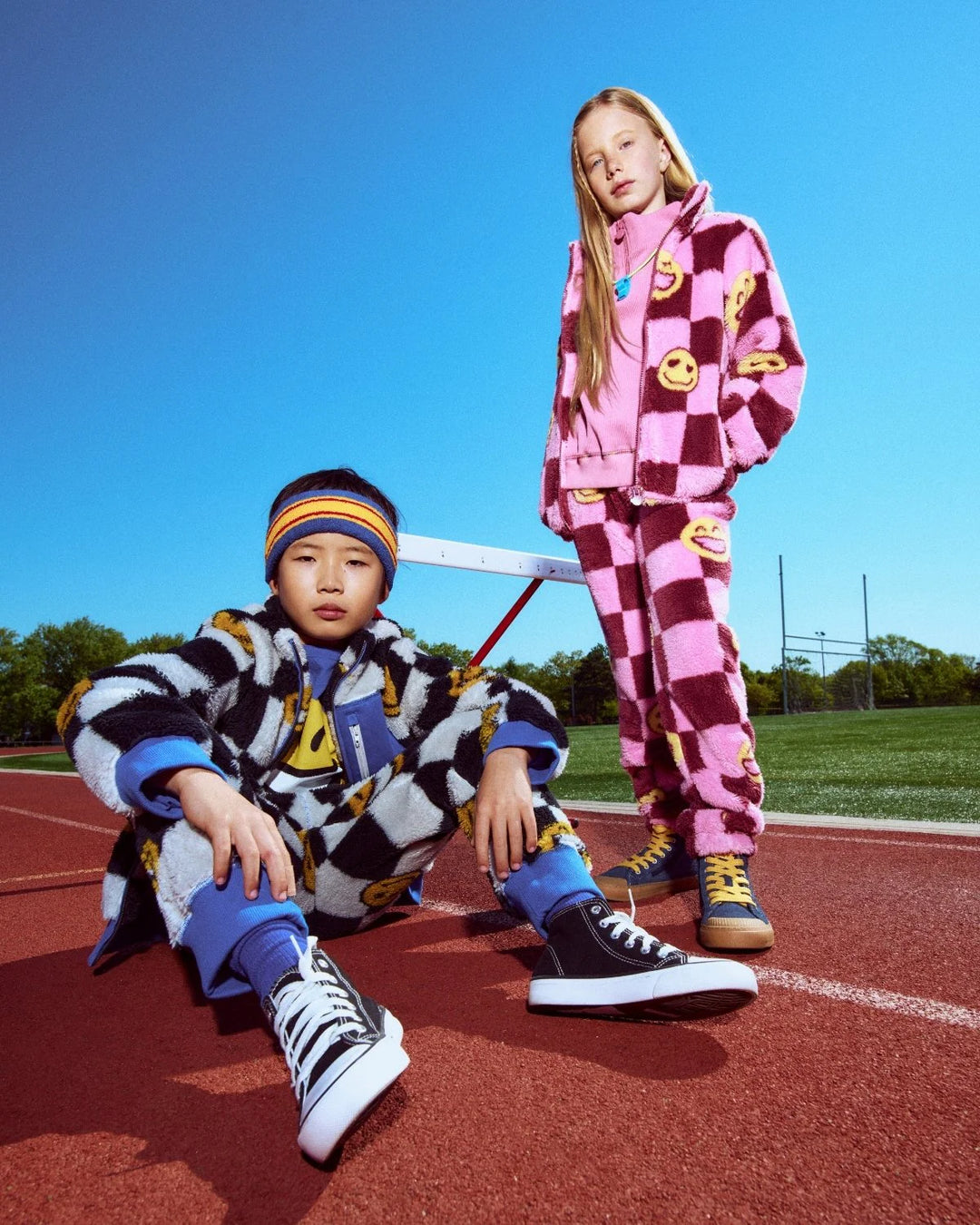 two kids in each checkered sherpas 