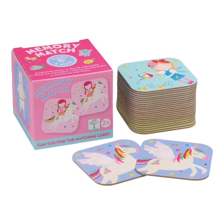 Memory match game with pink packaging and colorful cards featuring unicorns and fairies.