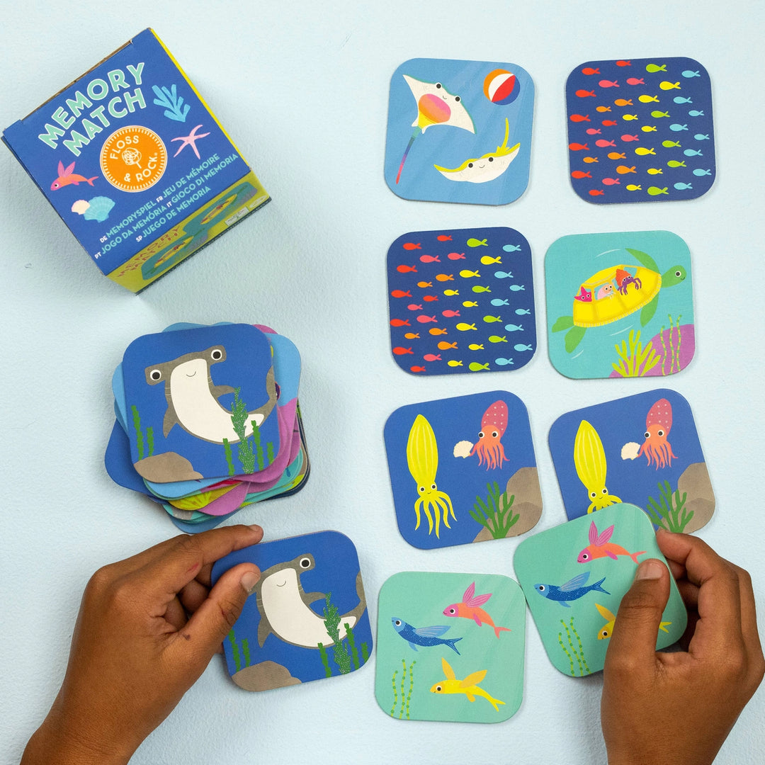 Children's memory match game with ocean-themed cards on a light blue background