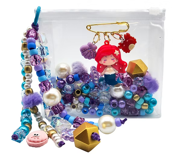 Colorful beaded jewelry set with a mermaid charm on a white background