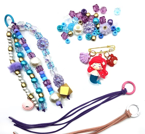 Colorful beaded lanyard with charms on a white background
