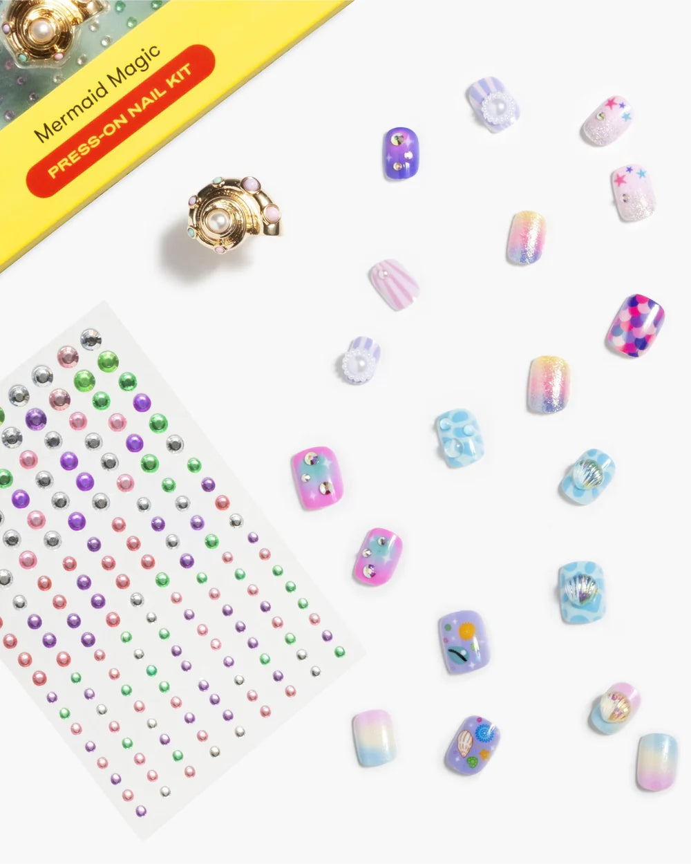 picture of some of the nails outside of the packaging with a pastel color scheme. 