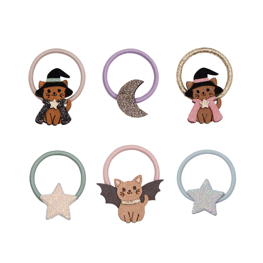 Set of six decorative hair ties with cat and bat designs on a white background