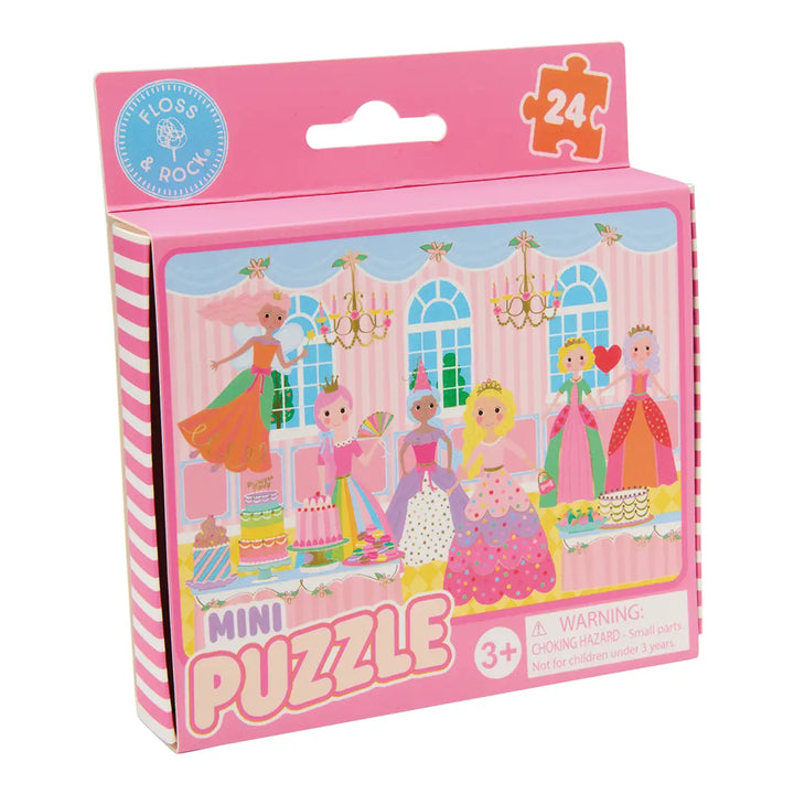 Pink packaging of a mini puzzle with princess design on a white background