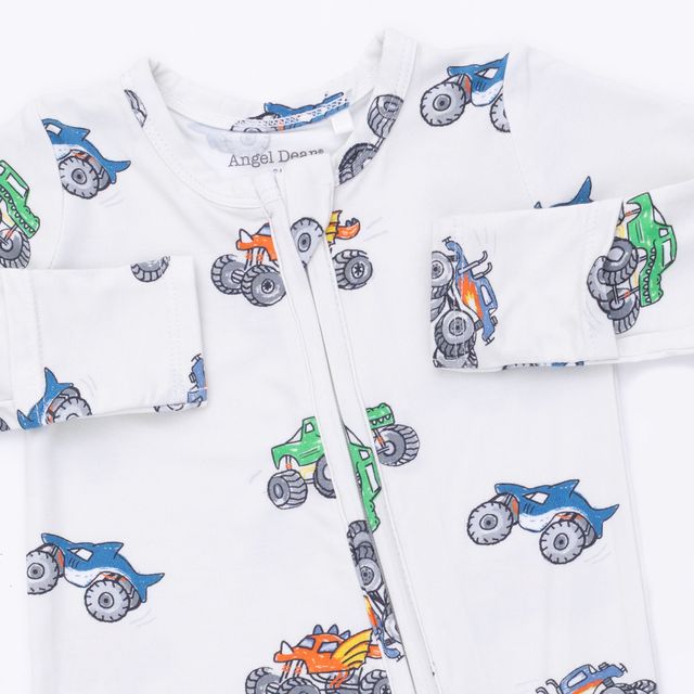 top of the baby footie, white with multicolor monster truck print all over