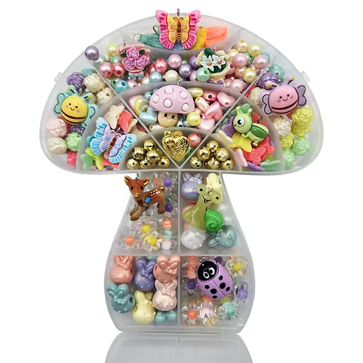 Colorful assortment of decorative beads and charms in a clear organizer on a white background