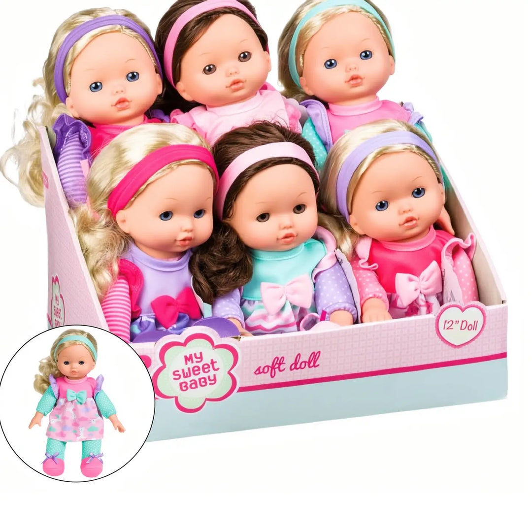 A boxed set of six soft dolls in pastel clothing and colorful headbands, displayed in a pink and light blue retail box. A circular inset shows one doll wearing a pink dress.